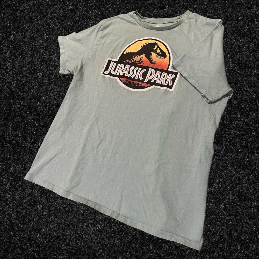 Jurassic Park Tropical style Graphic Logo on Light Blue/Teal Tee